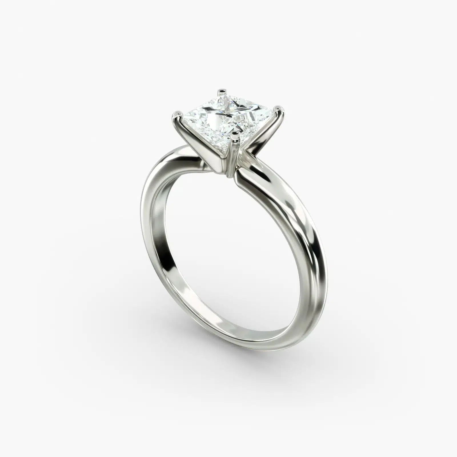 A close-up side view of a simple solitaire 2 carat princess cut lab-grown diamond engagement ring, highlighting the stone's setting in 14k white gold.