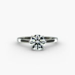 A close-up studio shot of a **Hearts and Arrows Diamond Engagement Ring**, highlighting the perfect proportions of the solitaire diamond and the classic design of the 14K white gold band.