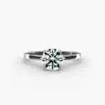A close-up studio shot of a **Hearts and Arrows Diamond Engagement Ring**, highlighting the perfect proportions of the solitaire diamond and the classic design of the 14K white gold band.