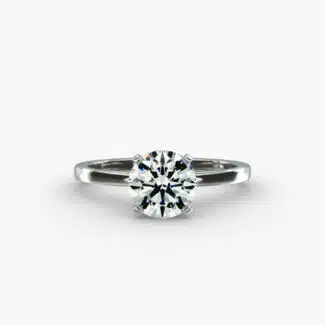A close-up studio shot of a **Hearts and Arrows Diamond Engagement Ring**, highlighting the perfect proportions of the solitaire diamond and the classic design of the 14K white gold band.