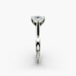 A close-up side view of a 4 carat radiant cut diamond ring, highlighting the secure prongs and the tapered 14k white gold band.