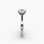 A close-up side view of a 4 carat radiant cut diamond ring, highlighting the secure prongs and the tapered 14k white gold band.
