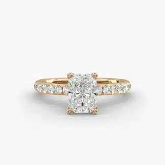 A close-up side view of a 3ct radiant cut diamond ring, showcasing the narrow 1.80mm yellow gold band and the subtle micropavé sparkle.
