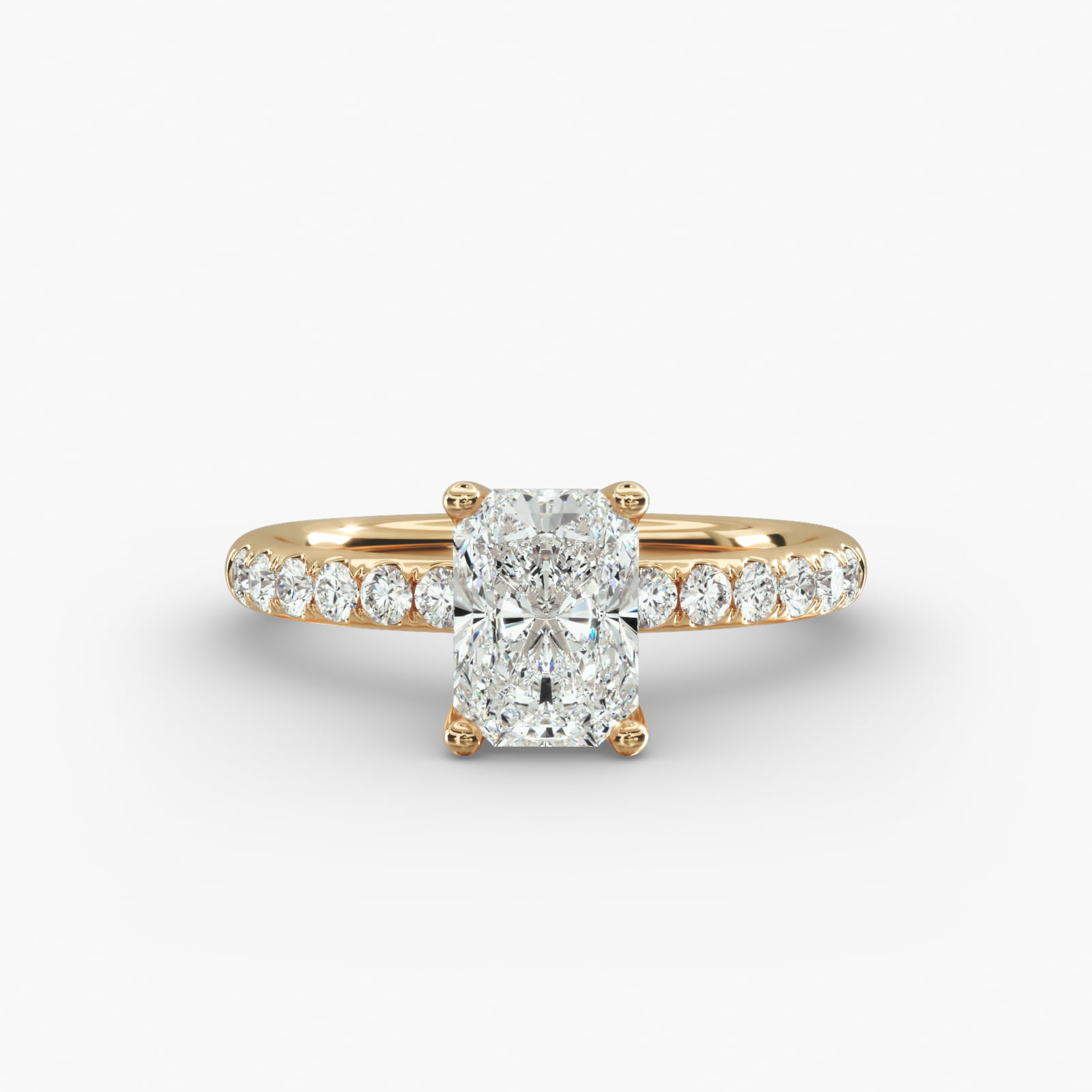 A close-up side view of a 3ct radiant cut diamond ring, showcasing the narrow 1.80mm yellow gold band and the subtle micropavé sparkle.