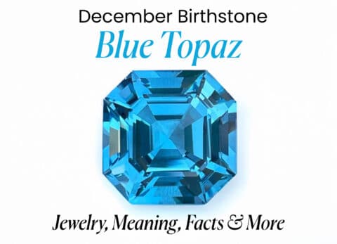 A high-quality, eye-level photograph of a faceted, emerald-cut blue topaz gemstone on a white background. The stone is a vivid, deep blue with bright internal reflections, and the text "December Birthstone Blue Topaz Jewelry, Meaning, Facts & More" is superimposed on the image.