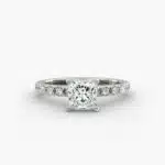 A close-up studio shot of a **7 carat diamond ring**, highlighting the sharp corners of the Princess cut diamond and the delicate detail of the French pavé side stones.