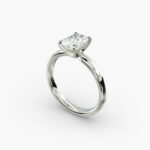 A close-up side view of a 5 ct radiant cut diamond ring, showcasing the durable 2.50mm Platinum Comfort Fit band.