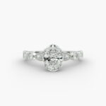 A close-up studio shot of a 7 carat diamond ring, highlighting the elegant shape of the oval diamond and the sparkling marquise side stones.