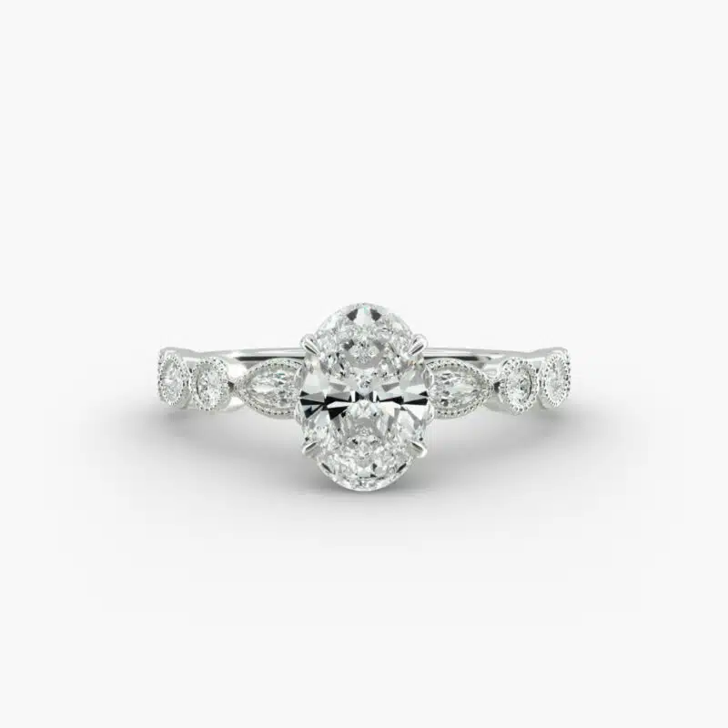 A close-up studio shot of a 7 carat diamond ring, highlighting the elegant shape of the oval diamond and the sparkling marquise side stones.