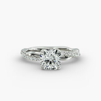 A close-up side view of a 2 carat radiant cut diamond ring, highlighting the G-VS1 clarity of the center stone and the detailed Pavé Rope setting.