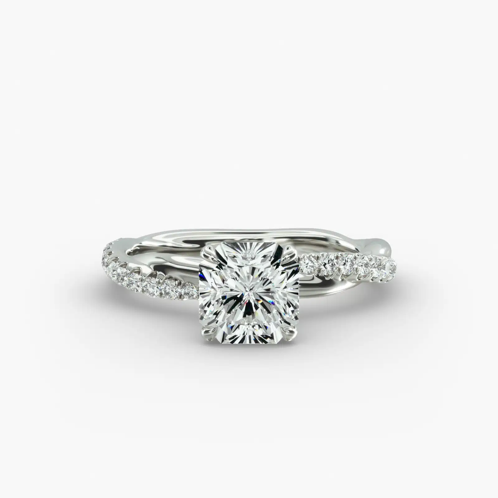 A close-up side view of a 2 carat radiant cut diamond ring, highlighting the G-VS1 clarity of the center stone and the detailed Pavé Rope setting.