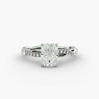 A close-up side view of a 2 carat radiant cut diamond ring, highlighting the F-VS1 clarity of the center stone and the elegant twist setting.