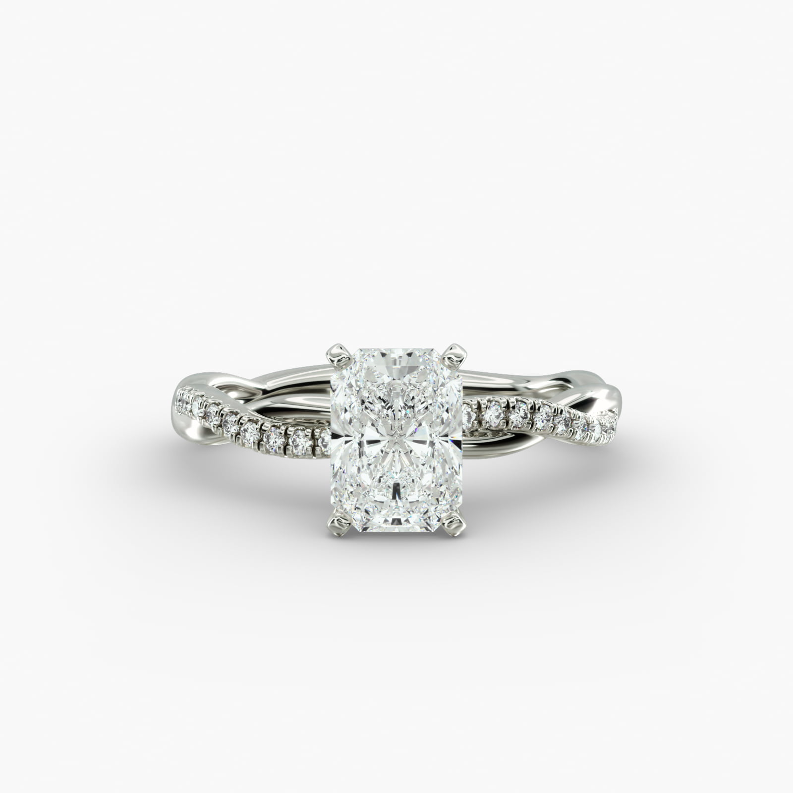 Petite Twist 2 Carat Radiant Cut Diamond Ring in 14k White Gold A close-up side view of a 2 carat radiant cut diamond ring, highlighting the F-VS1 clarity of the center stone and the elegant twist setting.