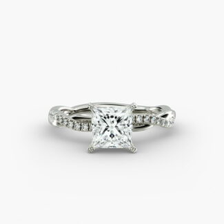 A close-up studio shot of a 2 carat princess cut diamond engagement ring, highlighting the sharp corners of the D-IF diamond and the twisting pavé setting.