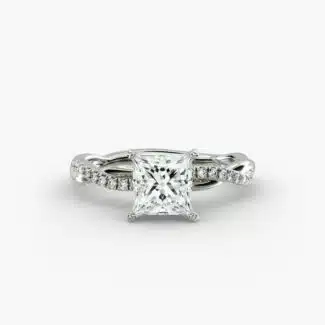 A close-up studio shot of a 2 carat princess cut diamond engagement ring, highlighting the sharp corners of the D-IF diamond and the twisting pavé setting.