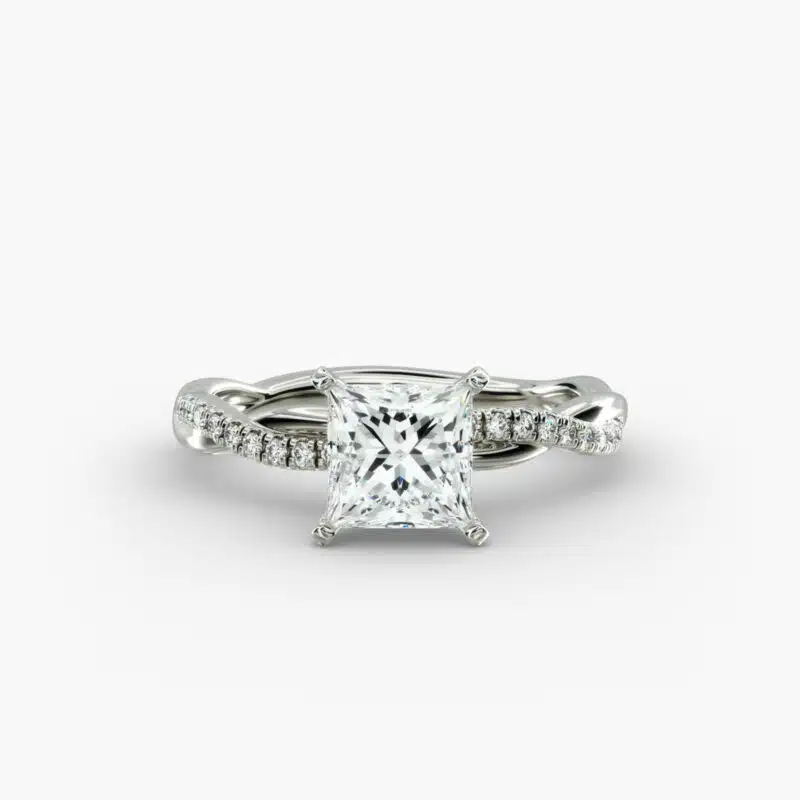A close-up studio shot of a 2 carat princess cut diamond engagement ring, highlighting the sharp corners of the D-IF diamond and the twisting pavé setting.