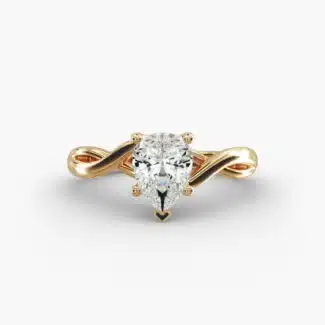 A close-up studio shot of a 7 carat diamond ring, highlighting the stunning D-VS2 pear diamond and the elegant twist solitaire setting.