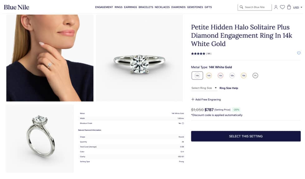 A screenshot of the Petite Hidden Halo Solitaire Plus engagement ring setting details from the Blue Nile website, made with 14k white gold.