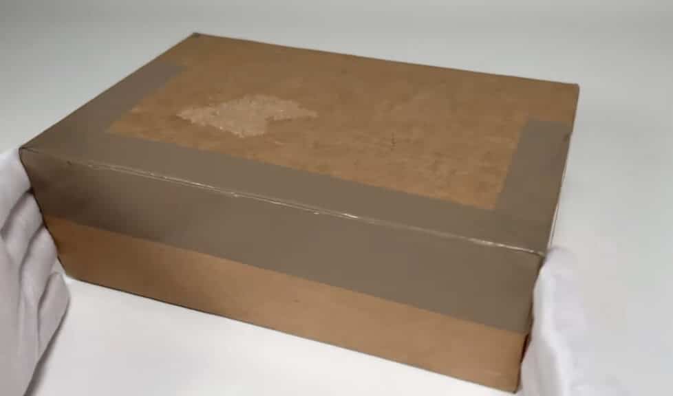 The first layer of the Blue Nile unboxing experience: a taped-up shipping box, ready to be opened to reveal a diamond engagement ring.