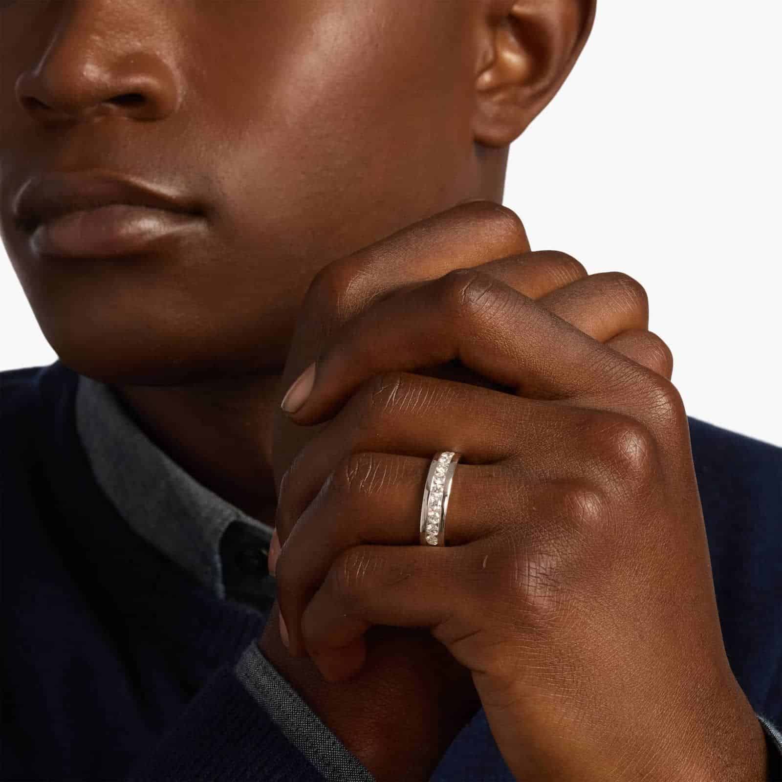 A close-up of a wide 14K white gold channel band with 1.00 ct. tw. lab grown diamonds, a top example of men's lab grown diamond rings for sale.