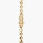 A spectacular lab created diamond tennis necklace featuring 20 CTW of F-G/VS2-SI1 round lab-grown diamonds in an illusion setting, handcrafted in radiant 14K Yellow Gold.