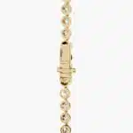 A spectacular lab created diamond tennis necklace featuring 20 CTW of F-G/VS2-SI1 round lab-grown diamonds in an illusion setting, handcrafted in radiant 14K Yellow Gold.