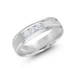 A photograph of a 6mm wide men's wedding ring made of 14kt White Gold, with a satin finish and three channel-set lab-grown diamonds, one of our best men's lab grown diamond rings for sale.