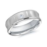 A close-up image of a 7mm wide men's wedding ring in 14kt White Gold, featuring a satin finish, concave center, and a single 0.08 CTW lab-grown diamond. This is a premium option among men's lab grown diamond rings for sale.