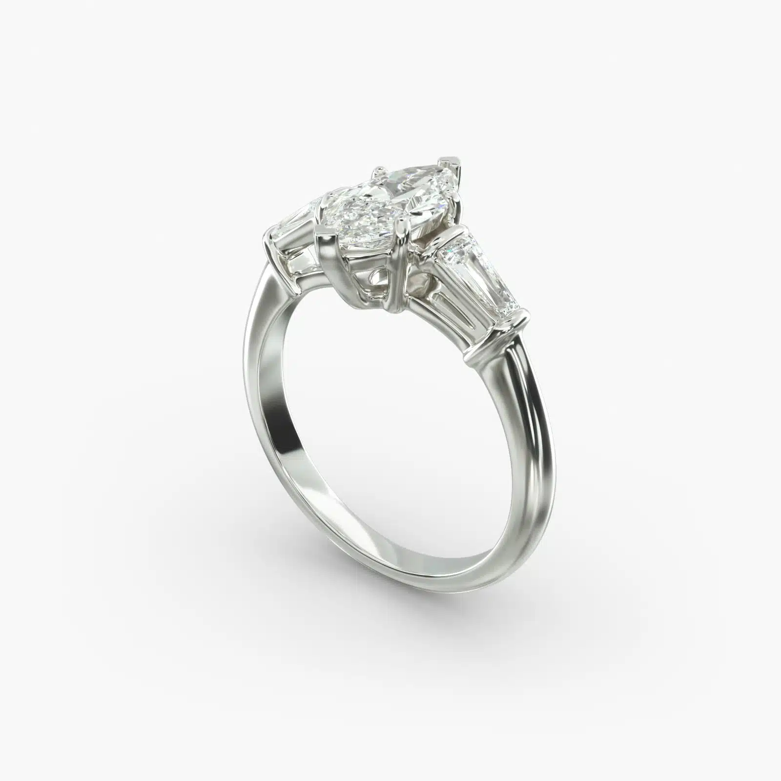 A close-up studio shot of a marquise cut diamond ring, highlighting the straight lines of the tapered baguette side stones against the center diamond.
