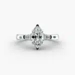 A close-up view of a marquise diamond ring with pear-shaped accents, highlighting the elongated 2.21 ratio and IF clarity.