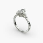 A close-up view of a marquise diamond ring with pear-shaped accents, highlighting the elongated 2.21 ratio and IF clarity.