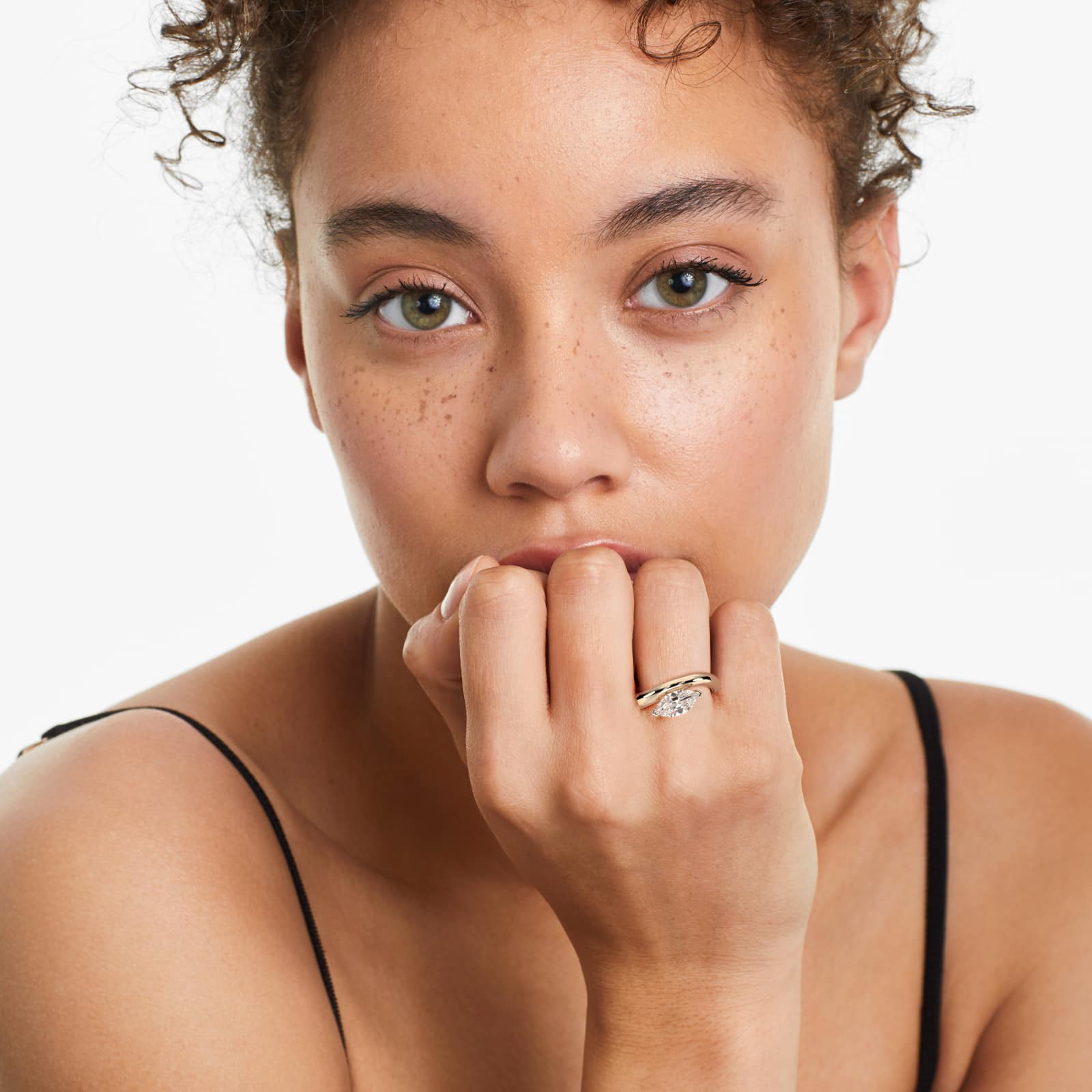 F-VS2 7.00 Ct. Marquise Solitaire Diamond Engagement Ring | Lab-Grown Yellow Gold model view 2 A woman's hand wearing a massive marquise solitaire diamond engagement ring with a 7.00 ct. lab-grown center stone in a 14K yellow gold setting.