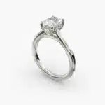 A close-up side view of a 6 ct radiant cut diamond ring, showcasing the delicate 1.60mm band and the hidden halo accent diamonds.