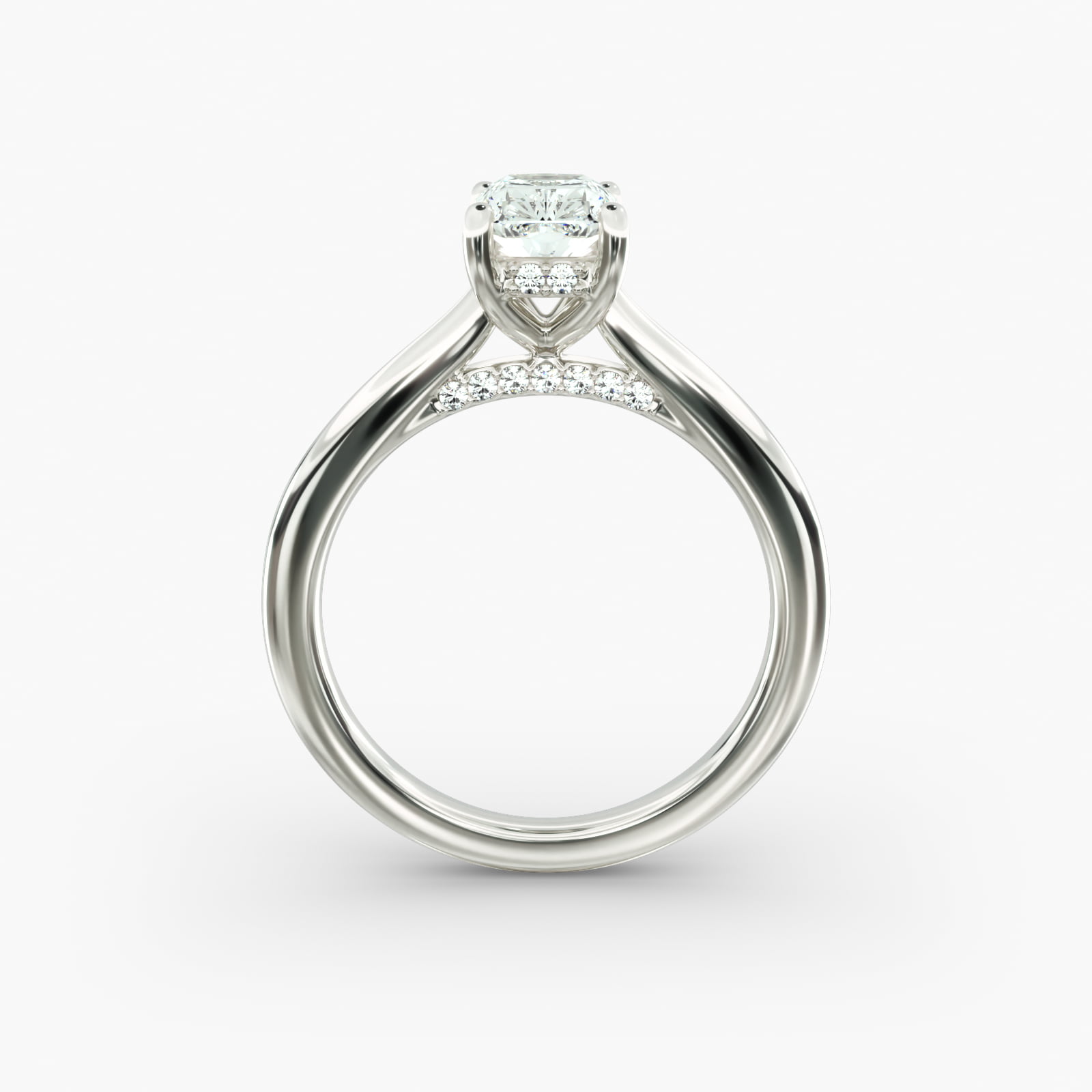 A close-up side view of a 6 ct radiant cut diamond ring, showcasing the delicate 1.60mm band and the hidden halo accent diamonds.