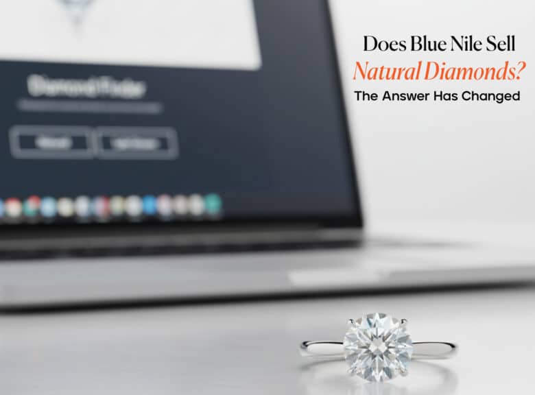 A 2-carat platinum solitaire engagement ring in sharp focus with a laptop displaying the Blue Nile Diamond Finder in the background. Text overlay asks, "Does Blue Nile Sell Natural Diamonds?"