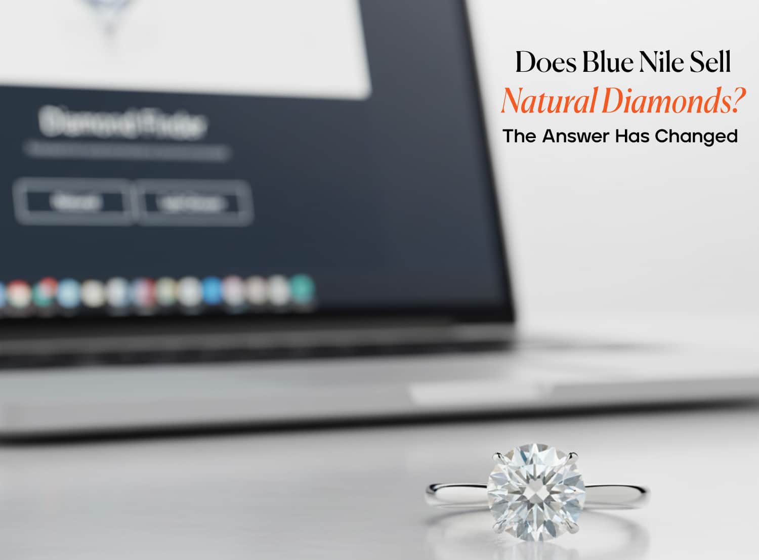A 2-carat platinum solitaire engagement ring in sharp focus with a laptop displaying the Blue Nile Diamond Finder in the background. Text overlay asks, "Does Blue Nile Sell Natural Diamonds?"