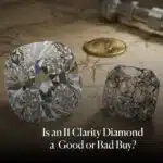 Feature image for I1 clarity diamonds, showing a brilliant, eye-clean diamond next to a heavily included, fractured diamond, with a gold coin and compass on a treasure map background, asking "Is an I1 Clarity Diamond a Good or Bad Buy?".