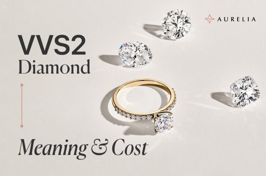 An 18k yellow gold solitaire engagement ring set with a VVS2 diamond, with several loose VVS2 diamonds scattered on a white background.