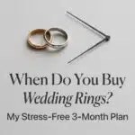 Minimalist image featuring two wedding rings (gold and silver) next to black clock hands set on a gray background, illustrating the headline "When Do You Buy Wedding Rings? My Stress-Free 3-Month Plan."