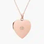 A closed 18-inch Sweetheart Locket with a single diamond accent in 14K Rose Gold, a romantic example of Luxury Push Present Ideas for a new mother.