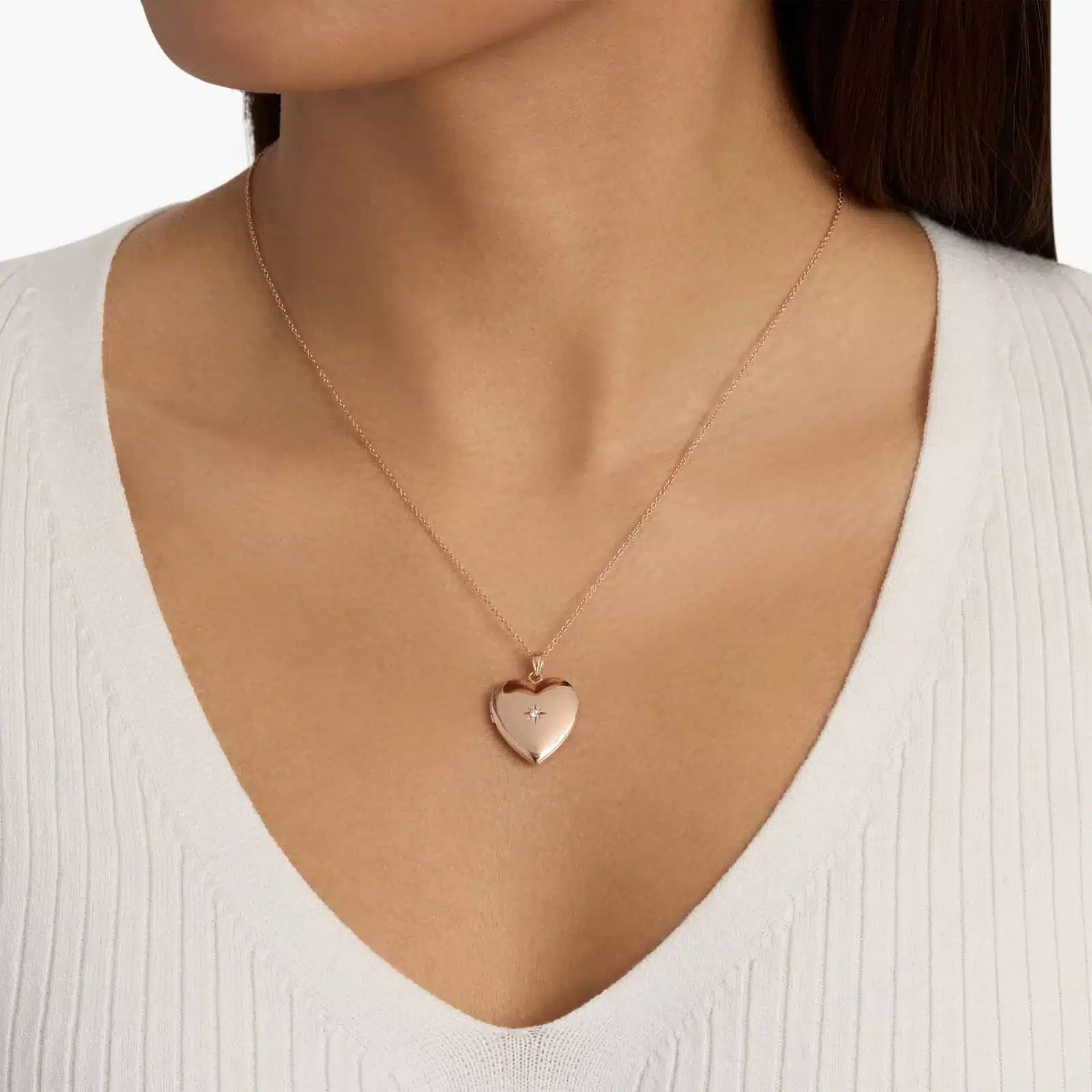 18 Sweetheart Locket with Diamond Detail in 14k Rose Gold model view 2 A closed 18-inch Sweetheart Locket with a single diamond accent in 14K Rose Gold, a romantic example of Luxury Push Present Ideas for a new mother.