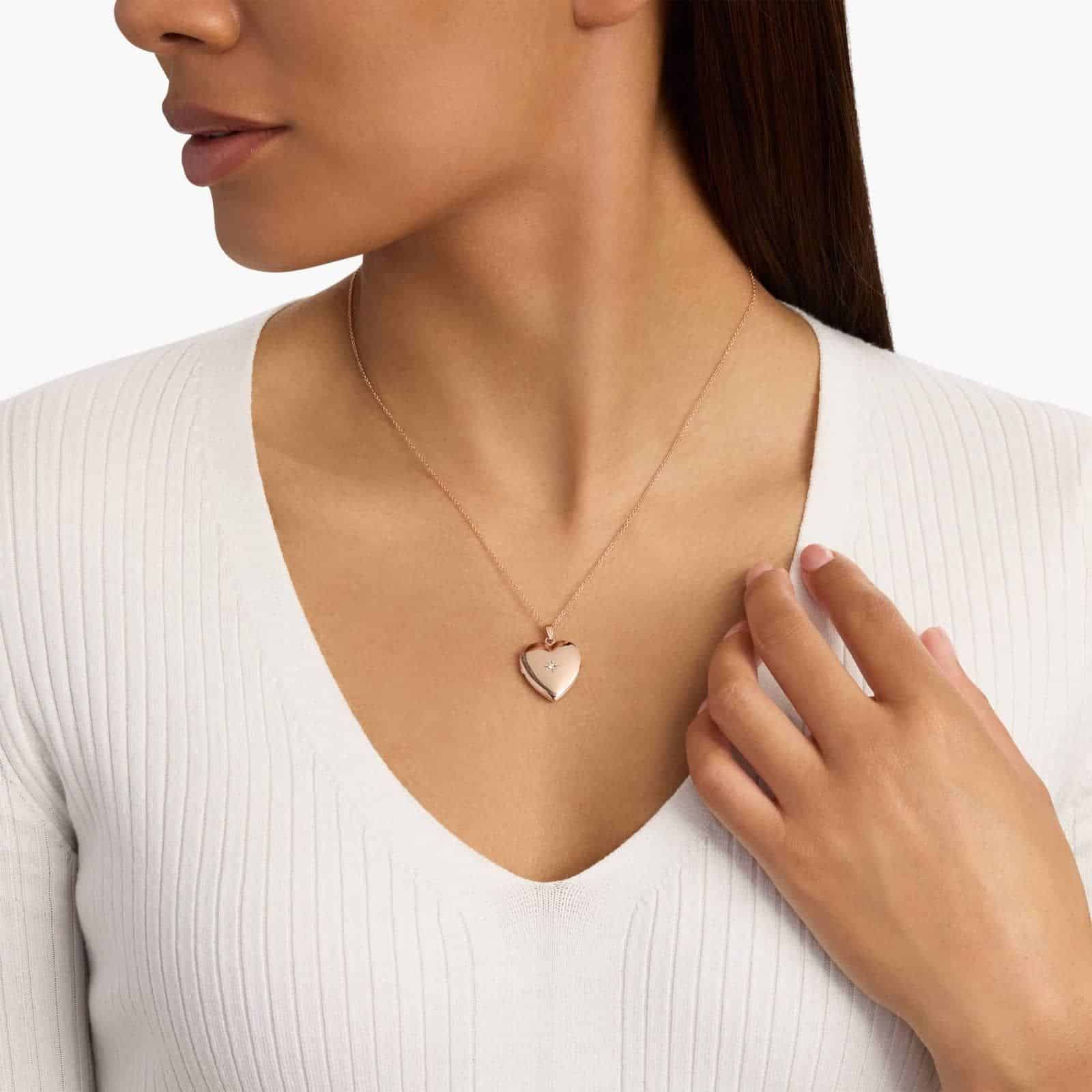 A closed 18-inch Sweetheart Locket with a single diamond accent in 14K Rose Gold, a romantic example of Luxury Push Present Ideas for a new mother.