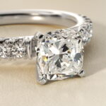 close view of A spectacular 4.00 Carat Elongated Cushion Cut Diamond Ring (E/VVS1 Lab-Grown Diamond) set in a French Pavé Platinum band.