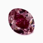 A GIA-certified 0.61 carat Oval Fancy Vivid Purplish Pink Diamond with VS2 clarity, offered by Blue Nile.