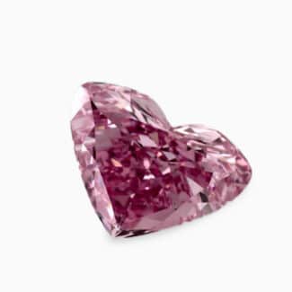 A GIA-certified 0.66 carat Heart Shape Fancy Vivid Purplish Pink Diamond with IF clarity, a rare piece among Loose Pink Diamonds For Sale.