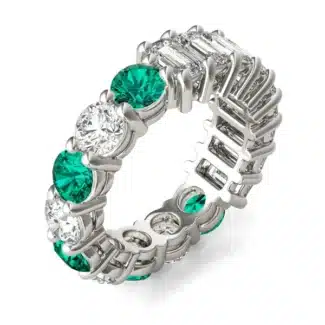 An Alternating Emerald Paradox Eternity Band from Charles & Colvard, featuring alternating lab-grown round and emerald-cut stones with emerald color accents, a unique option among Luxury Push Present Ideas.