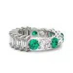 An Alternating Emerald Paradox Eternity Band from Charles & Colvard, featuring alternating lab-grown round and emerald-cut stones with emerald color accents, a unique option among Luxury Push Present Ideas.