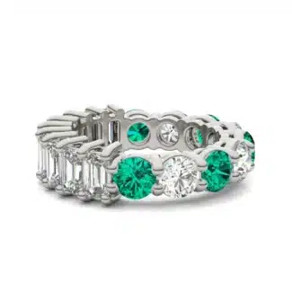 An Alternating Emerald Paradox Eternity Band from Charles & Colvard, featuring alternating lab-grown round and emerald-cut stones with emerald color accents, a unique option among Luxury Push Present Ideas.