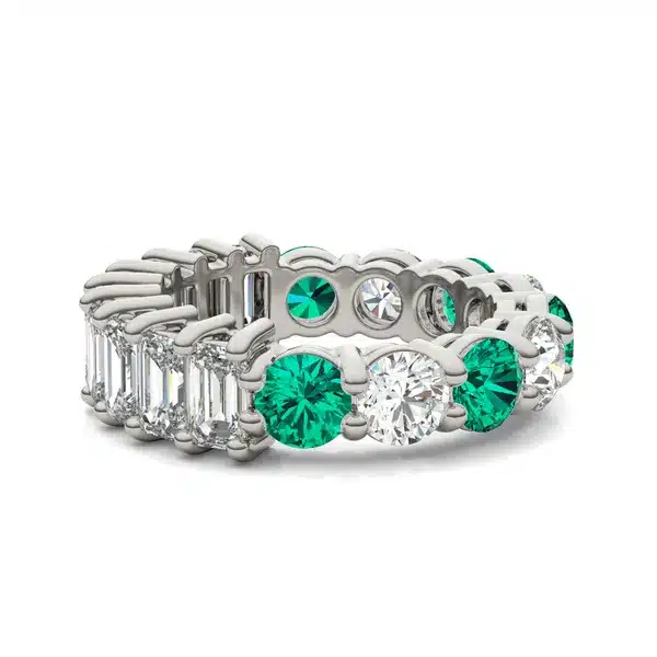 An Alternating Emerald Paradox Eternity Band from Charles & Colvard, featuring alternating lab-grown round and emerald-cut stones with emerald color accents, a unique option among Luxury Push Present Ideas.