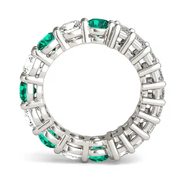 An Alternating Emerald Paradox Eternity Band from Charles & Colvard, featuring alternating lab-grown round and emerald-cut stones with emerald color accents, a unique option among Luxury Push Present Ideas.